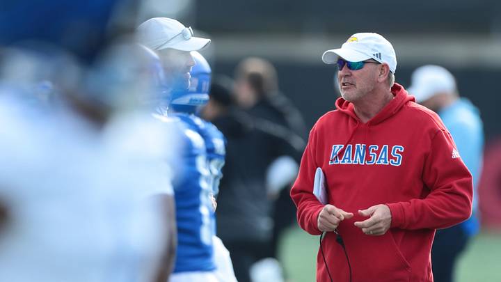 Kansas football head coach Lance Leipold talks with assistants during practice at the University of Kansas on Thursday, April 9, 2026. Kansas football head coach Lance Leipold talks with assistants during practice at the University of Kansas on Thursday, April 9, 2026.