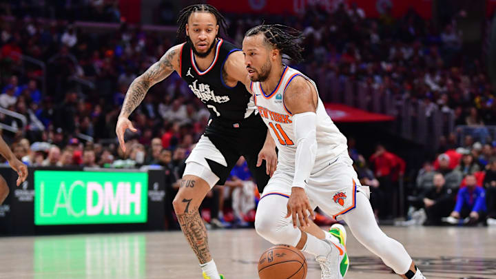 Dec 16, 2023; Los Angeles, California, USA; New York Knicks guard Jalen Brunson (11) moves the ball against Los Angeles Clippers guard Amir Coffey (7) during the second half at Crypto.com Arena. Mandatory Credit: Gary A. Vasquez-Imagn Images