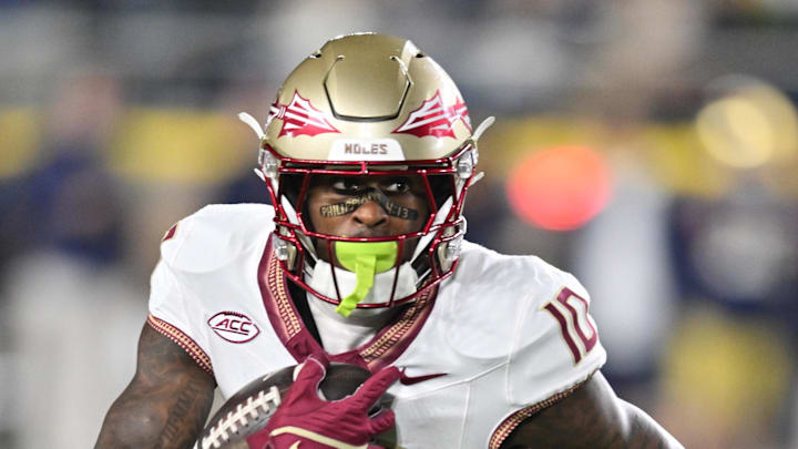 Nov 9, 2024; South Bend, Indiana, USA; Florida State Seminoles wide receiver Malik Benson (10) carries against the Notre Dame Fighting Irish in the first quarter at Notre Dame Stadium. Mandatory Credit: Matt Cashore-Imagn Images