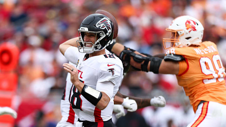 Oct 27, 2024; Tampa, Florida, USA; Atlanta Falcons quarterback Kirk Cousins (18) drops back to pass against the Tampa Bay Buccaneers in the second quarter at Raymond James Stadium. Mandatory Credit: Nathan Ray Seebeck-Imagn Images