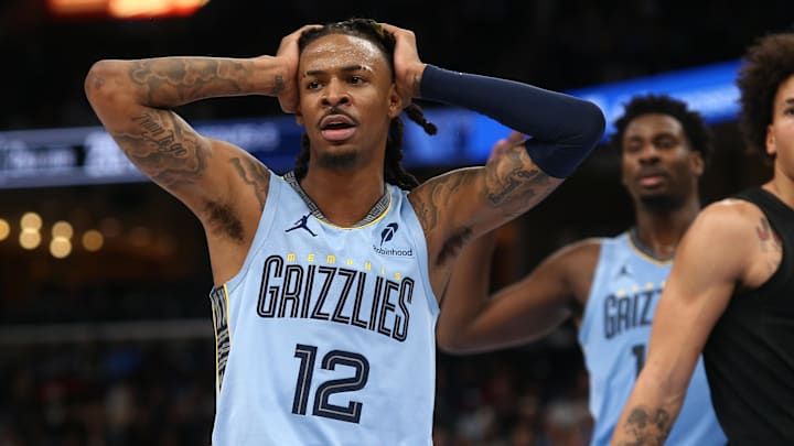Dec 13, 2024; Memphis, Tennessee, USA; Memphis Grizzlies guard Ja Morant (12) reacts during the second quarter against the Brooklyn Nets at FedExForum. Mandatory Credit: Petre Thomas-Imagn Images Dec 13, 2024; Memphis, Tennessee, USA; Memphis Grizzlies guard Ja Morant (12) reacts during the second quarter against the Brooklyn Nets at FedExForum. Mandatory Credit: Petre Thomas-Imagn Images