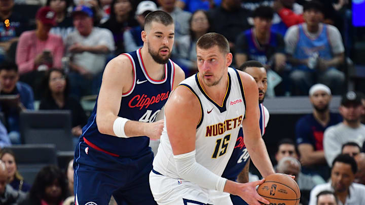 Apr 24, 2025; Inglewood, California, USA; Denver Nuggets center Nikola Jokic (15) controls the ball against Los Angeles Clippers center Ivica Zubac (40) during the second half of game three in the first round for the 2024 NBA Playoffs at Intuit Dome. Mandatory Credit: Gary A. Vasquez-Imagn Images Apr 24, 2025; Inglewood, California, USA; Denver Nuggets center Nikola Jokic (15) controls the ball against Los Angeles Clippers center Ivica Zubac (40) during the second half of game three in the first round for the 2024 NBA Playoffs at Intuit Dome. Mandatory Credit: Gary A. Vasquez-Imagn Images