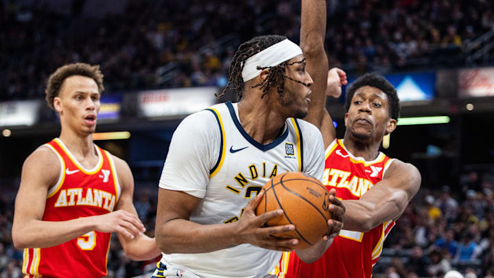Feb 1, 2025; Indianapolis, Indiana, USA; Indiana Pacers center Myles Turner (33) shoots the ball against Atlanta Hawks forward De'Andre Hunter (12) in the second half at Gainbridge Fieldhouse. Mandatory Credit: Trevor Ruszkowski-Imagn Images