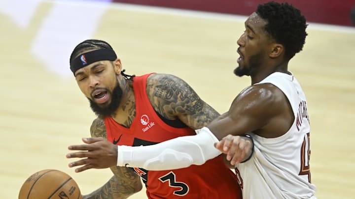 Nov 13, 2025; Cleveland, Ohio, USA; Cleveland Cavaliers guard Donovan Mitchell (45) defends Toronto Raptors forward Brandon Ingram (3) in the fourth quarter at Rocket Arena. Mandatory Credit: David Richard-Imagn Images