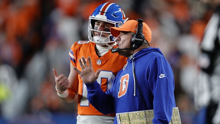 Nov 6, 2025; Denver, Colorado, USA; Denver Broncos head coach Sean Payton talks with quarterback Bo Nix (10) during the second half at Empower Field at Mile High. 