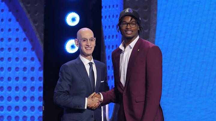 Jun 23, 2026; New York, NY, USA; NBA commissioner Adam Silver greets the ninth pick in the 2026 NBA draft, Michigan forward Morez Johnson Jr. after he was selected by the Dallas Mavericks at Barclays Center. Mandatory Credit: Brad Penner-Imagn Images