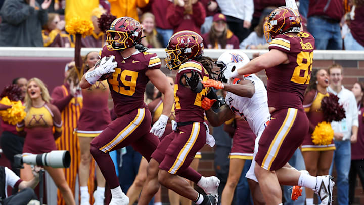 Sep 6, 2025; Minneapolis, Minnesota, USA; Minnesota Golden Gophers linebacker Matt Kingsbury (49) returns a fumble recovery for a touchdown against the Northwestern State Demons during the first quarter at Huntington Bank Stadium. Mandatory Credit: Matt Krohn-Imagn Images