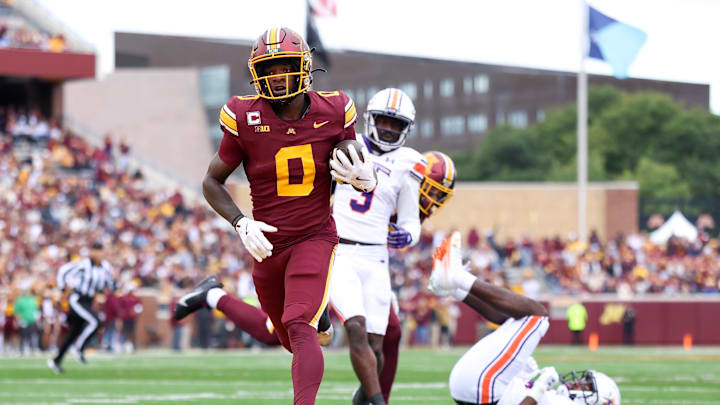 Sep 6, 2025; Minneapolis, Minnesota, USA; Minnesota Golden Gophers wide receiver Le'Meke Brockington (0) runs the ball for a touchdown against the Northwestern State Demons during the first quarter at Huntington Bank Stadium. Mandatory Credit: Matt Krohn-Imagn Images