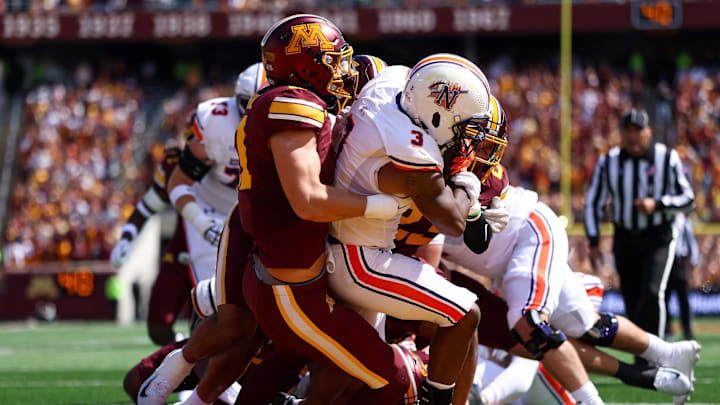 Sep 6, 2025; Minneapolis, Minnesota, USA; Minnesota Golden Gophers defensive lineman Karter Menz (11) tackles Northwestern State Demons running back Kolbe Burrell (3) during the second quarter at Huntington Bank Stadium. Mandatory Credit: Matt Krohn-Imagn Images Sep 6, 2025; Minneapolis, Minnesota, USA; Minnesota Golden Gophers defensive lineman Karter Menz (11) tackles Northwestern State Demons running back Kolbe Burrell (3) during the second quarter at Huntington Bank Stadium. Mandatory Credit: Matt Krohn-Imagn Images