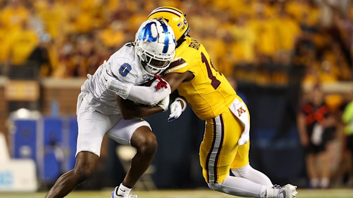 Aug 28, 2025; Minneapolis, Minnesota, USA; Minnesota Golden Gophers defensive back Kerry Brown (14) tackles Buffalo Bulls wide receiver Victor Snow (0) during the second half of the game at Huntington Bank Stadium. Mandatory Credit: Matt Krohn-Imagn Images Aug 28, 2025; Minneapolis, Minnesota, USA; Minnesota Golden Gophers defensive back Kerry Brown (14) tackles Buffalo Bulls wide receiver Victor Snow (0) during the second half of the game at Huntington Bank Stadium. Mandatory Credit: Matt Krohn-Imagn Images