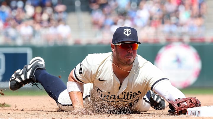 Minnesota Twins first baseman Ty France (13) dives to first base for a force out on a ball hit by Kansas City Royals first baseman Vinnie Pasquantino (9) during the eighth inning at Target Field on May 25. Minnesota Twins first baseman Ty France (13) dives to first base for a force out on a ball hit by Kansas City Royals first baseman Vinnie Pasquantino (9) during the eighth inning at Target Field on May 25.