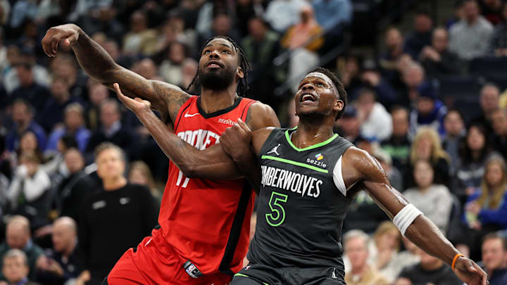Feb 6, 2025; Minneapolis, Minnesota, USA; Minnesota Timberwolves guard Anthony Edwards (5) and Houston Rockets forward Tari Eason (17) compete for a rebound during the first quarter at Target Center. Mandatory Credit: Matt Krohn-Imagn Images