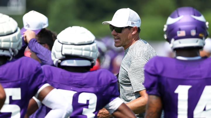 Jul 28, 2025; Eagan, MN, USA; Minnesota Vikings head coach Kevin O'Connell talks with the wide receivers during the teams training camp at the Minnesota Vikings Training Facility.