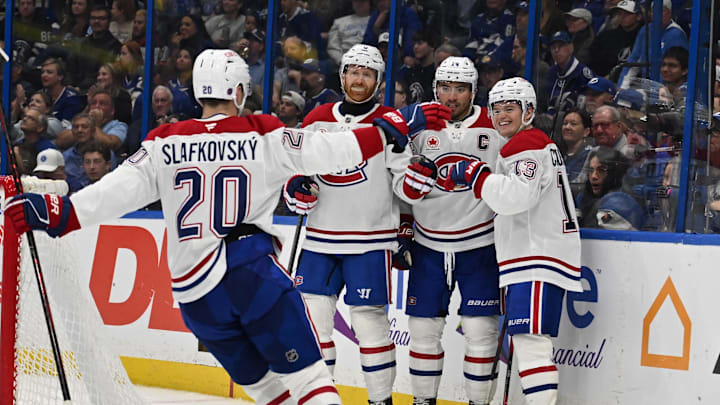 Mar 31, 2026; Tampa, Florida, USA;  Montreal Canadian right wing Cole Caufield (13) celebrates with his teammates after scoring a goal  in the second period against the Tampa Bay Lightning at Benchmark International Arena. Mandatory Credit: Jonathan Dyer-Imagn Images
