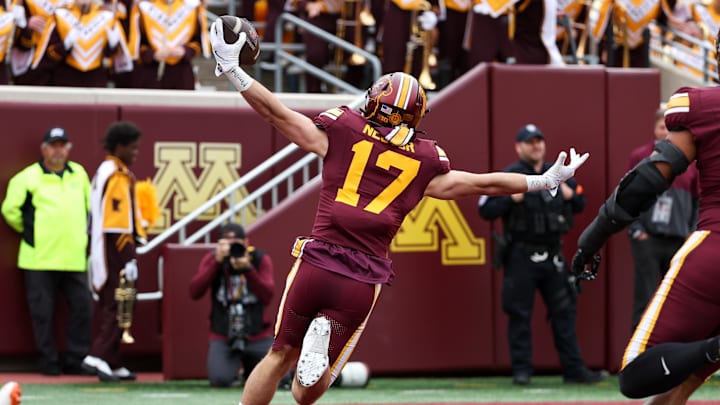 Sep 6, 2025; Minneapolis, Minnesota, USA; Minnesota Golden Gophers defensive back John Nestor (17) celebrates as he returns an interception for a touchdown against the Northwestern State Demons during the first quarter at Huntington Bank Stadium. Mandatory Credit: Matt Krohn-Imagn Images