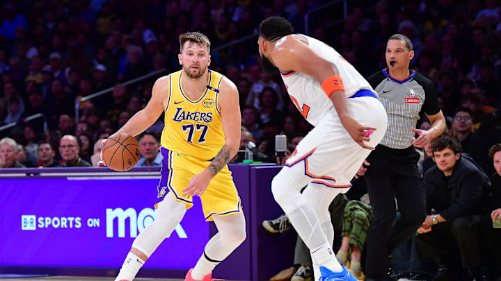 Mar 6, 2025; Los Angeles, California, USA; Los Angeles Lakers guard Luka Doncic (77) moves the ball against New York Knicks center Karl-Anthony Towns (32) during the second half at Crypto.com Arena. Mandatory Credit: Gary A. Vasquez-Imagn Images Mar 6, 2025; Los Angeles, California, USA; Los Angeles Lakers guard Luka Doncic (77) moves the ball against New York Knicks center Karl-Anthony Towns (32) during the second half at Crypto.com Arena. Mandatory Credit: Gary A. Vasquez-Imagn Images