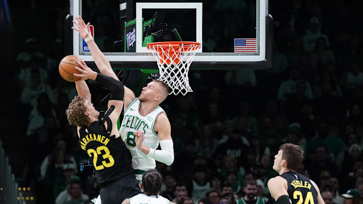 Jan 5, 2024; Boston, Massachusetts, USA; Boston Celtics center Kristaps Porzingis (8) defends against Utah Jazz forward Lauri Markkanen (23) in the first quarter at TD Garden. Mandatory Credit: David Butler II-Imagn Images