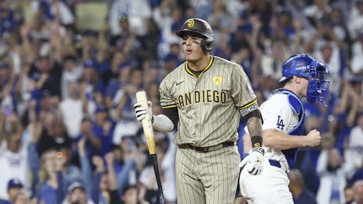 Oct 5, 2024; Los Angeles, California, USA; San Diego Padres third baseman Manny Machado (13) strikes out in the ninth inning against the Los Angeles Dodgers during game one of the NLDS for the 2024 MLB Playoffs at Dodger Stadium. Mandatory Credit: Kiyoshi Mio-Imagn Images Oct 5, 2024; Los Angeles, California, USA; San Diego Padres third baseman Manny Machado (13) strikes out in the ninth inning against the Los Angeles Dodgers during game one of the NLDS for the 2024 MLB Playoffs at Dodger Stadium. Mandatory Credit: Kiyoshi Mio-Imagn Images
