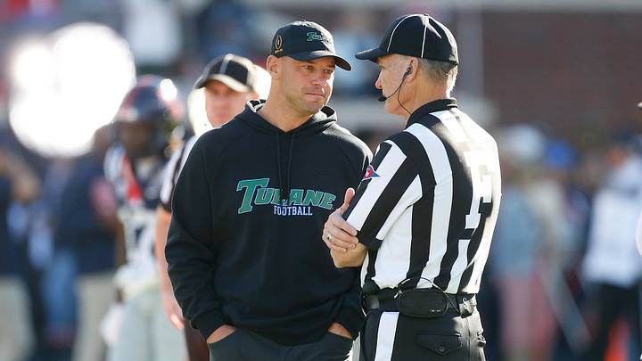 Dec 20, 2025; Oxford, MS, USA; Tulane Green Wave head coach Jon Sumrall talks with an official prior to the game against the Mississippi Rebels at Vaught-Hemingway Stadium. Mandatory Credit: Petre Thomas-Imagn Images