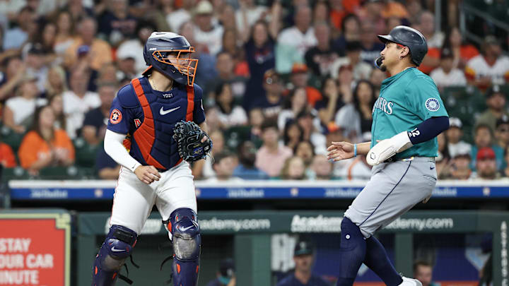 Sep 21, 2025; Houston, Texas, USA; Seattle Mariners first baseman Josh Naylor (12) is forced out at home plate by Houston Astros catcher Yainer Diaz (21) in the second inning at Daikin Park. Mandatory Credit: Thomas Shea-Imagn Images Sep 21, 2025; Houston, Texas, USA; Seattle Mariners first baseman Josh Naylor (12) is forced out at home plate by Houston Astros catcher Yainer Diaz (21) in the second inning at Daikin Park. Mandatory Credit: Thomas Shea-Imagn Images