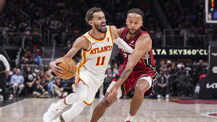 Feb 24, 2025; Atlanta, Georgia, USA; Atlanta Hawks guard Trae Young (11) dribbles against Miami Heat forward Kyle Anderson (20) during the second half at State Farm Arena. Mandatory Credit: Dale Zanine-Imagn Images