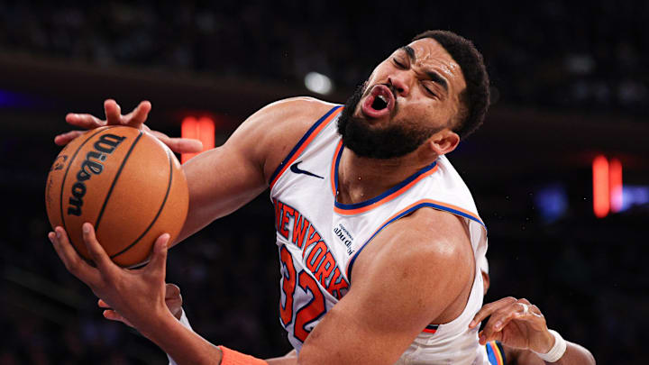 Mar 4, 2026; New York, New York, USA; New York Knicks center Karl-Anthony Towns (32) rebounds against Oklahoma City Thunder guard Shai Gilgeous-Alexander (2) during the second half at Madison Square Garden. Mandatory Credit: Vincent Carchietta-Imagn Images