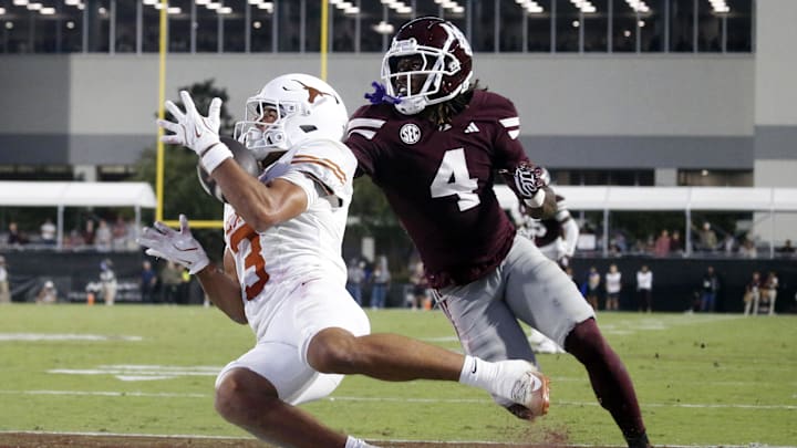 Oct 25, 2025; Starkville, Mississippi, USA; Texas Longhorns wide receiver Emmett Mosley V (3) catches the ball for a touchdown as Mississippi State Bulldogs defensive back DeAgo Brumfield (4) defends during the fourth quarter at Davis Wade Stadium at Scott Field. Mandatory Credit: Petre Thomas-Imagn Images Oct 25, 2025; Starkville, Mississippi, USA; Texas Longhorns wide receiver Emmett Mosley V (3) catches the ball for a touchdown as Mississippi State Bulldogs defensive back DeAgo Brumfield (4) defends during the fourth quarter at Davis Wade Stadium at Scott Field. Mandatory Credit: Petre Thomas-Imagn Images
