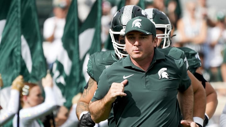 Sep 13, 2025; East Lansing, Michigan, USA; Michigan State head coach Jonathan Smith takes the field before a game against Youngstown State at Spartan Stadium. Mandatory Credit: Brendan Mullin-Imagn Images