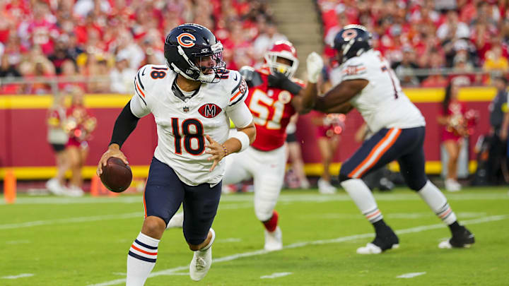 Aug 22, 2025; Kansas City, Missouri, USA; Chicago Bears quarterback Caleb Williams (18) scrambles during the first half against the Kansas City Chiefs at GEHA Field at Arrowhead Stadium. Mandatory Credit: Jay Biggerstaff-Imagn Images