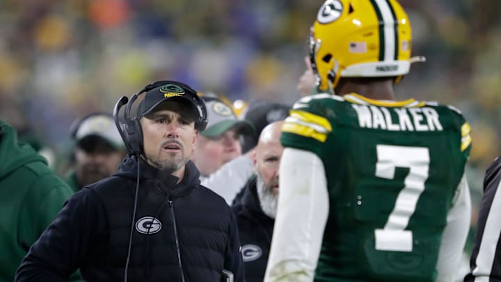 Green Bay Packers head coach Matt LaFleur approaches linebacker Quay Walker (7) after he was ejected from the game against the Detroit Lions during their football game Sunday, January 8, 2023, at Lambeau Field in Green Bay, Wis.