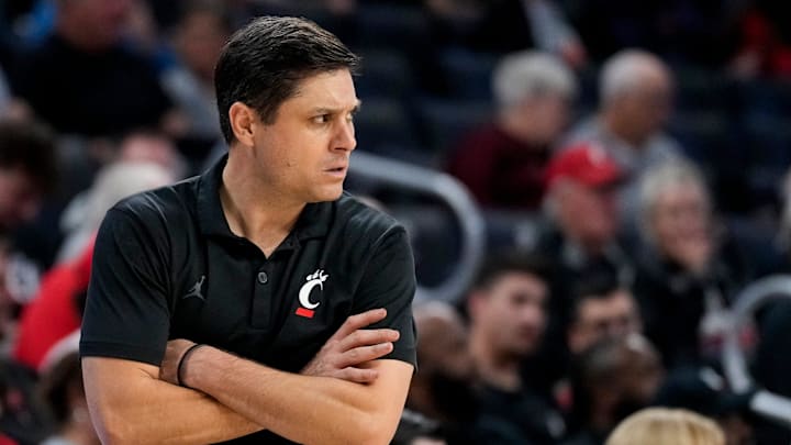 Nov 4, 2024; Cincinnati, OH, USA; Cincinnati Bearcats head coach Wes Miller paces the sideline in the second half of the NCAA mens basketball game between the Cincinnati Bearcats and the Arkansas-Pine Bluff Golden Lions at Fifth Third Arena on the University of Cincinnati campus on Monday, Nov. 4, 2024. The Bearcats won 109-54. Mandatory Credit: Sam Greene/USA TODAY Network via Imagn Images Nov 4, 2024; Cincinnati, OH, USA; Cincinnati Bearcats head coach Wes Miller paces the sideline in the second half of the NCAA mens basketball game between the Cincinnati Bearcats and the Arkansas-Pine Bluff Golden Lions at Fifth Third Arena on the University of Cincinnati campus on Monday, Nov. 4, 2024. The Bearcats won 109-54. Mandatory Credit: Sam Greene/USA TODAY Network via Imagn Images