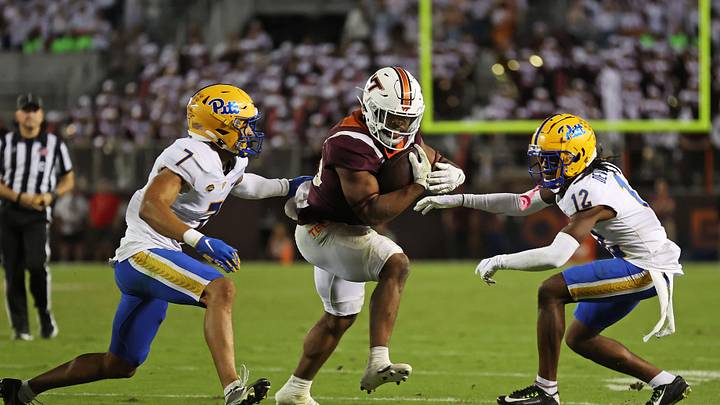 Sep 30, 2023; Blacksburg, Va.; Virginia Tech running back Bhayshul Tuten (33) runs the ball against Pittsburgh defensive backs. Sep 30, 2023; Blacksburg, Va.; Virginia Tech running back Bhayshul Tuten (33) runs the ball against Pittsburgh defensive backs.