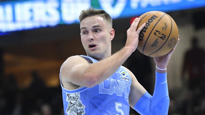 Dec 23, 2024; Cleveland, Ohio, USA; Cleveland Cavaliers guard Sam Merrill (5) rebounds in the first quarter against the Utah Jazz at Rocket Mortgage FieldHouse. Mandatory Credit: David Richard-Imagn Images Dec 23, 2024; Cleveland, Ohio, USA; Cleveland Cavaliers guard Sam Merrill (5) rebounds in the first quarter against the Utah Jazz at Rocket Mortgage FieldHouse. Mandatory Credit: David Richard-Imagn Images
