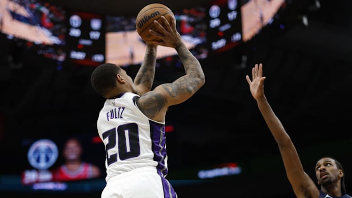 Apr 2, 2025; Washington, District of Columbia, USA; Sacramento Kings guard Markelle Fultz (20) shoots the ball over Washington Wizards forward Alex Sarr (20) in the first half at Capital One Arena. Mandatory Credit: Geoff Burke-Imagn Images Apr 2, 2025; Washington, District of Columbia, USA; Sacramento Kings guard Markelle Fultz (20) shoots the ball over Washington Wizards forward Alex Sarr (20) in the first half at Capital One Arena. Mandatory Credit: Geoff Burke-Imagn Images