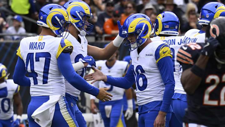 Sep 29, 2024; Chicago, Illinois, USA;  Los Angeles Rams place kicker Joshua Karty (16) celebrates with teammates after he kicks a field goal against the Chicago Bears first half at Soldier Field. Mandatory Credit: Matt Marton-Imagn Images