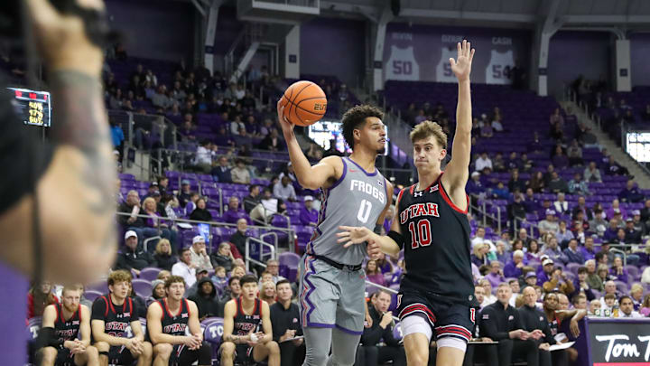 Jan. 15, 2025-TCU's Brendan Wenzel (0) tries to pass around Utah's Jake Whalin (10) in the Schollmaier Arena. Jan. 15, 2025-TCU's Brendan Wenzel (0) tries to pass around Utah's Jake Whalin (10) in the Schollmaier Arena.