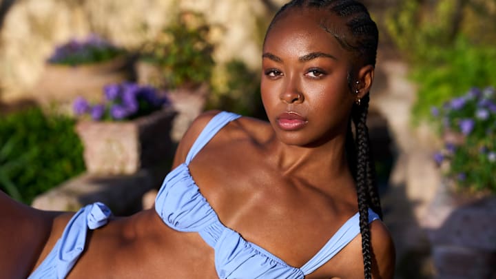 Rayniah Jones was photographed by Taylor Ballantyne. Swimsuit by Faithfull the Brand.