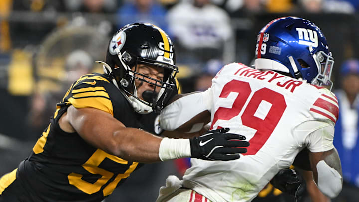 Oct 28, 2024; Pittsburgh, Pennsylvania, USA; Pittsburgh Steelers linebacker Alex Highsmith (56) tackles New York Giants running back Tyrone Tracy Jr. (29) during the second quarter at Acrisure Stadium. 