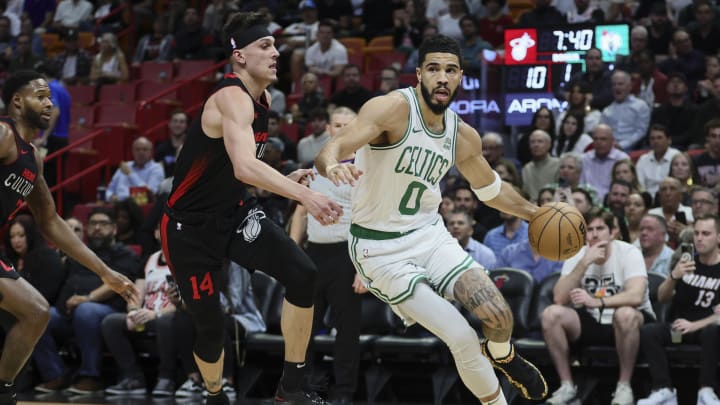 Jan 25, 2024; Miami, Florida, USA; Boston Celtics forward Jayson Tatum (0) drives to the basket past Miami Heat guard Tyler Herro. Jan 25, 2024; Miami, Florida, USA; Boston Celtics forward Jayson Tatum (0) drives to the basket past Miami Heat guard Tyler Herro.