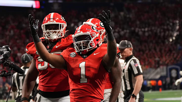 Dec 7, 2024; Atlanta, GA, USA; Georgia Bulldogs running back Trevor Etienne (1) reacts after rushing for a touchdown against the Texas Longhorns during the second half in the 2024 SEC Championship game at Mercedes-Benz Stadium. Mandatory Credit: Dale Zanine-Imagn Images