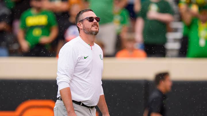 Oregon head coach Dan Lanning takes in the rain as the Oregon Ducks face the Oklahoma State Cowboys on Sept. 12, 2026, at Boone Pickens Stadium in Stillwater, Oklahoma.