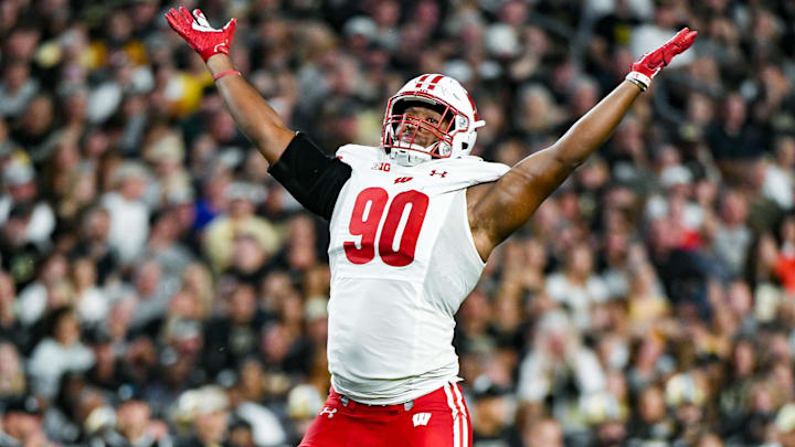 Sep 22, 2023; West Lafayette, Indiana, USA; Wisconsin Badgers defensive end James Thompson Jr. (90) celebrates after sacking Purdue Boilermakers quarterback Hudson Card (1) during the first half at Ross-Ade Stadium. Mandatory Credit: Robert Goddin-Imagn Images