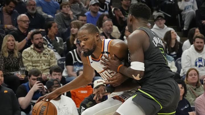 Mar 28, 2025; Minneapolis, Minnesota, USA; Phoenix Suns forward Kevin Durant (35) works around Minnesota Timberwolves guard Anthony Edwards (5) in the fourth quarter at Target Center. Mandatory Credit: Bruce Kluckhohn-Imagn Images Mar 28, 2025; Minneapolis, Minnesota, USA; Phoenix Suns forward Kevin Durant (35) works around Minnesota Timberwolves guard Anthony Edwards (5) in the fourth quarter at Target Center. Mandatory Credit: Bruce Kluckhohn-Imagn Images