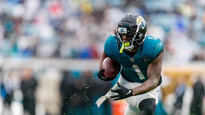 Dec 29, 2024; Jacksonville, Florida, USA; Jacksonville Jaguars running back Travis Etienne Jr. (1) runs the ball against the Tennessee Titans during the second quarter at EverBank Stadium. Mandatory Credit: Morgan Tencza-Imagn Images Dec 29, 2024; Jacksonville, Florida, USA; Jacksonville Jaguars running back Travis Etienne Jr. (1) runs the ball against the Tennessee Titans during the second quarter at EverBank Stadium. Mandatory Credit: Morgan Tencza-Imagn Images