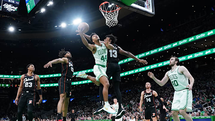 Boston Celtics guard Jaden Springer (44) shoots the ball against Detroit Pistons center James Wiseman (13) in the second quarter at TD Garden. 