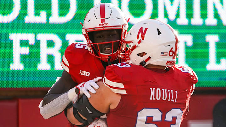Oct 21, 2023; Lincoln, Nebraska, USA; Nebraska Cornhuskers wide receiver Malachi Coleman (15) and offensive lineman Nouredin Nouili (63) during the fourth quarter against the Northwestern Wildcats at Memorial Stadium. Mandatory Credit: Dylan Widger-Imagn Images Oct 21, 2023; Lincoln, Nebraska, USA; Nebraska Cornhuskers wide receiver Malachi Coleman (15) and offensive lineman Nouredin Nouili (63) during the fourth quarter against the Northwestern Wildcats at Memorial Stadium. Mandatory Credit: Dylan Widger-Imagn Images
