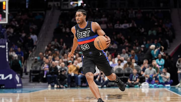 Nov 6, 2024; Charlotte, North Carolina, USA; Detroit Pistons guard Jaden Ivey (23) handles the ball against the Charlotte Hornets during the first quarter at Spectrum Center. Mandatory Credit: Jim Dedmon-Imagn Images