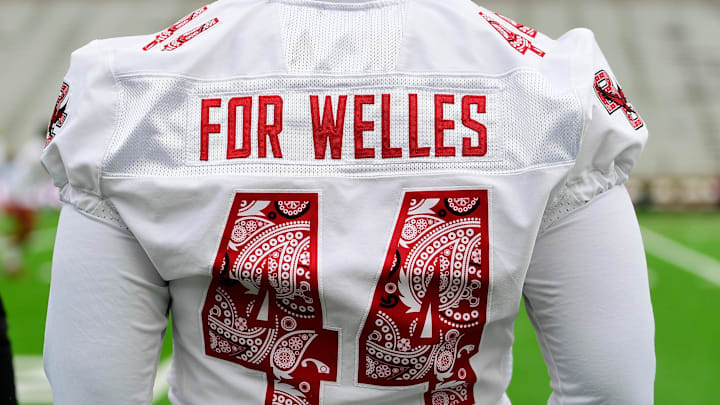 Sep 16, 2023; Chestnut Hill, Massachusetts, USA; A Boston College Eagles player wears a \"For Welles\" warm-up jersey honoring Welles Crowther before a game against the Florida State Seminoles at Alumni Stadium. Mandatory Credit: Eric Canha-Imagn Images