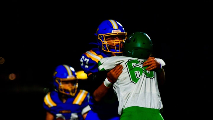 Kimball football senior Noah Merten blocks during a home Section 5-2A tournament game against Paynesville on Oct. 21, 2025. The Cubs won 14-0.