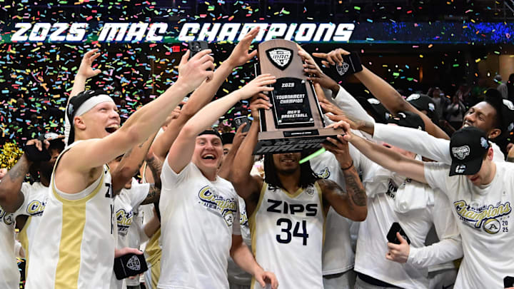 Mar 15, 2025; Cleveland, OH, USA;  The Akron Zips celebrate after winning the MAC Conference Tournament Championship game against the Miami (Oh) Redhawks at Rocket Arena. Mandatory Credit: Ken Blaze-Imagn Images
